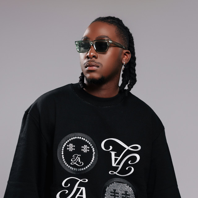 GL Ceejay in sunglasses and a black embroidered sweater